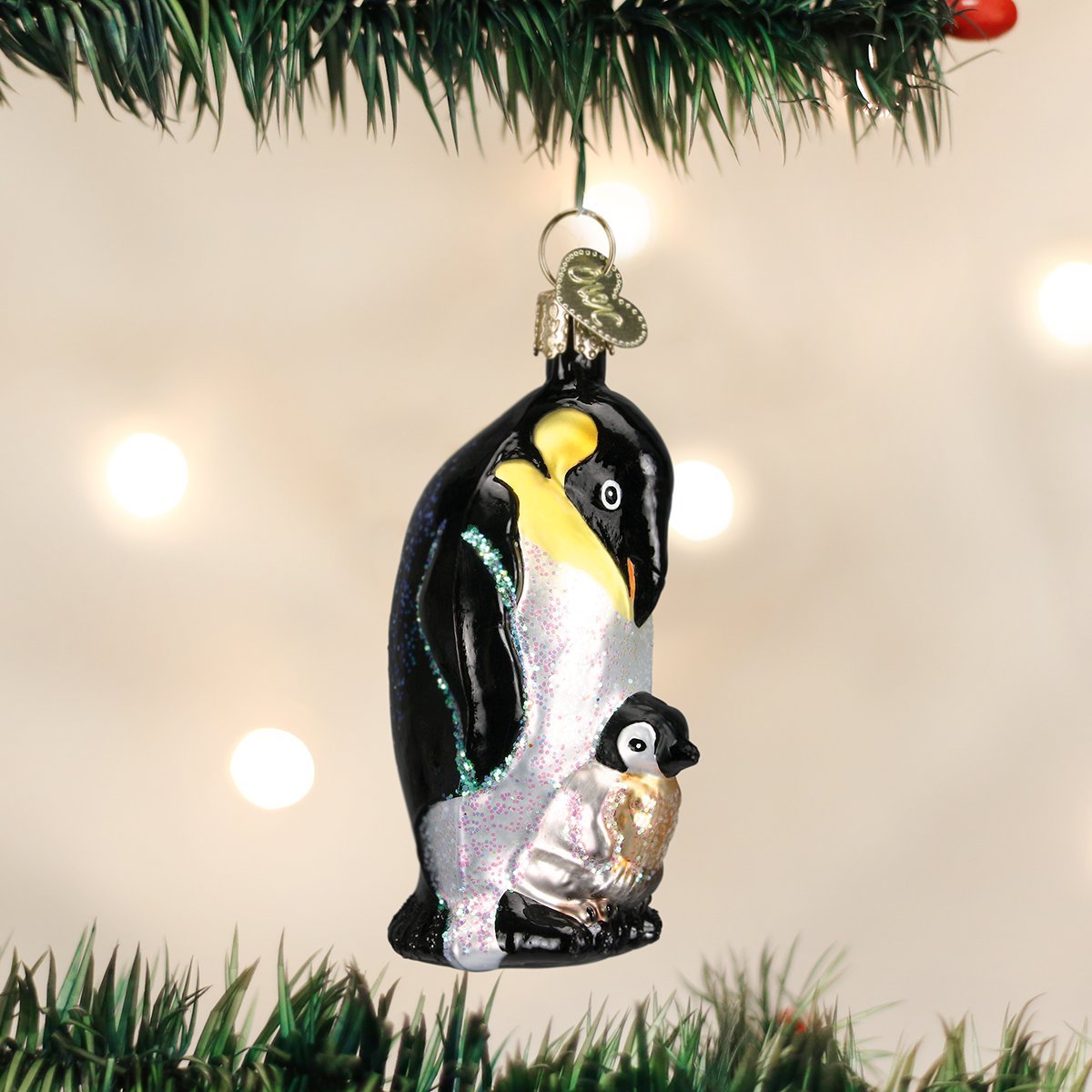 Old World Christmas Emperor Penguin with Chick, Green Glass Blown Ornament for Christmas Tree, Handcrafted Holiday Decoration, Wildlife Animal Collection