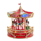 Kurt S. Adler 11.1“ Battery Operated Multicolor LED Lighted Musical Santa Carousel With Motion Table Piece
